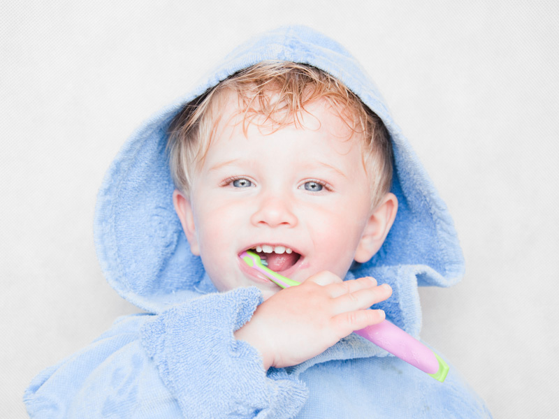 boy brushing his teeth